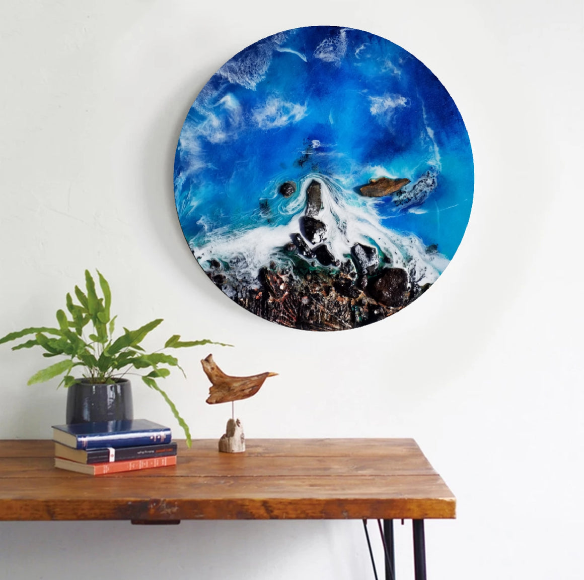 An original resin artwork showing the ocean crashing against the cliff